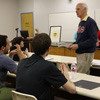 Dr. Stephen Carls (standing) talks to Phi Alpha Theta members about upcoming history events at the Delta-Psi chapter's fall plenary meeting on September 13, 2016. Photo by Elizabeth Wilson