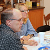 Robert Briley (left to right), his wife Brenda, and Seth Reid participate in a table conversation at the Delta-Psi chapter's Best Chapter Award pizza party on October 21, 2016.
