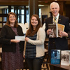 Delta-Psi Chapter President Jordan Sellers (second from right) presents a Phi Alpha Theta Best Chapter Award check to Union University Library Director Melissa Moore (center) at the university library on December 1, 2016. Other Delta-Psi members in the photo are Seth Reid (left), Kathryn Mitchell (second from left), and Dr. Stephen Carls (right). The chapter purchased the 12 displayed history books for the library with the national Best Chapter Award prize money. Photo by Elizabeth Wilson