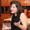 Phi Alpha Theta member Priscilla Porter performs an excerpt from Don Zolidis's Mall Santa Saves the Day as part of the program at the history department's French Christmas dinner on December 10, 2016.
