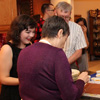 Attendees at the Phi Alpha Theta Christmas dinner on December 10, 2016, choose their desserts. In the foreground are (left to right, going clockwise) Priscilla Porter (wearing a black outfit) Dr. Terry Lindley, Luke Adkins, Jordan Sellers (back to camera), and Dr. Alice-Catherine Carls (back to camera), who is serving tiramisu.