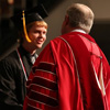 Union University President Dr. Samuel W. "Dub" Oliver congratulates history major Gideon Ragland at the school's commencement services on December 17, 2016, on his successful completion of a bachelor of science program. Photo by Kristi Woody