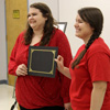 Jessica Barton (left) accepts congratulations from Delta-Psi President Jordan Sellers on her induction into Phi Alpha Theta on February 20, 2017.
