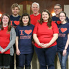 History faculty and students join together for a photo on Phi Alpha Theta's T-shirt-wearing 