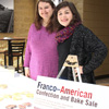 Delta-Psi chapter members Jessica Barton (left) and Priscilla Porter manage the Franco-American bake sale near the Lexington Inn on March 22, 2017.