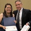 Dr. Henry Allen presents a book and certificate of recognition to Emily Littleton at the history awards banquet on May 4, 2017, for the paper she gave at the 2017 Tennessee Phi Alpha Theta Regional Conference on April 1. Photo by Janelle Vest