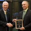 Rick Rudesill (right) accepts the 2017 History Alumni Distinguished Achievement Award from Dr. Stephen Carls at the History Department Awards Banquet on May 4, 2017. Photo by Janelle Vest