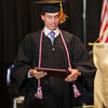 Phi Alpha Theta member Stephen Lewoczko is proud and happy after receiving his diploma at Union University's commencement exercises on May 20, 2017. Photo by Kristi Woody
