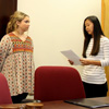 Delta-Psi Chapter Vice President Katherine Cheshire (right) conducts the Phi Alpha Theta induction ceremony for Nakota Wood (second from left) and Marylee Barker. Chapter President Seth Reid (left) observes.