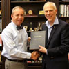 Dr. Stephen Carls (right) presents the bound volume of the private papers of John Jeter Hurt, Union University's president from 1932 to 1945, to Union's current president, Dr. Samuel W. ‘Dub” Oliver, on November 30, 2017. The letters were a gift from the Hurt family.