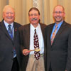 The Phi Alpha Theta executive committee members for the start of the society's 2018-2020 biennium stand together at the Phi Alpha Theta convention's Presidential Banquet on January 6, 2018. They are (left to right) Drs. Graydon Tunstall (executive director), Clayton Drees (president), Jochen Burgtorf (chair, advisory board), and Jacob Blosser (vice president).