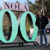 Dr. Stephen Carls (left) and Seth Reid stand by a sign on January 7, 2018, that celebrates the 300th anniversary of the founding of New Orleans in 1718.