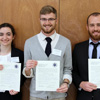 The three student paper prize winners at the Arkansas Phi Alpha Theta Regional Conference at the University of Arkansas at Monticello display their award certificates on April 7, 2018. They are (left to right) Leah Atkins (third place) and Luke Sower (first place) of Union University, and Matthew Harvey (second place) of the University of North Texas.
