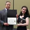 Leah Atkins accepts a book and a certificate of recognition from Dr. Henry Allen at the history awards banquet on May 3, 2018, for her paper presentation at the Arkansas Phi Alpha Theta Regional Conference on April 7. Photo by Katherine Cheshire