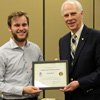Dr. Stephen Carls (right) presents a certificate of appreciation to Seth Reid at the history awards banquet on May 3, 2018, for his work as president of Union's Delta-Psi chapter of Phi Alpha Theta in 2017-2018. Photo by Katherine Cheshire