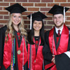 Graduating Phi Alpha Theta members stand together prior to Union University's spring graduation at the Oman Arena on May 19, 2018. They are (left to right) Ali Renckens, Katherine Cheshire, and Seth Reid.