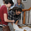 Lauren Butler (front left) and Katie Allison (front right) fill out name tags at the History Welcome Reception on September 10, 2018. Dr. Alice-Catherine Carls (back left) and Addison Osborne (back right) stand behind them.