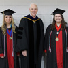 Graduating Phi Alpha Theta members Nakota Wood (left) and Jessica Barton stand with Dr. Stephen Carls prior to Union University's undergraduate commencement exercises on December 15, 2018.