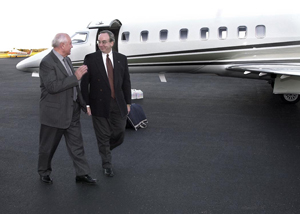 Mikhail Gorbachev is greeted at the airport by President Dockery.