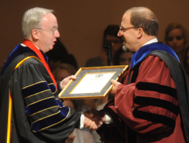 Union University President David S. Dockery (left) congratulates Scott Huelin upon his installation as director of the Honors Community during fall convocation. (Photo by Morris Abernathy)