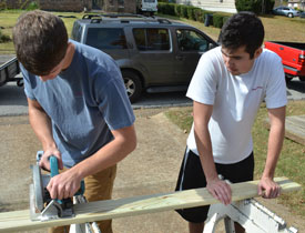 Union students Chase Pentecost and Davis Caldwell work on a ramp for a 
handicapped Jackson resident. (Photo by Morris Abernathy)
