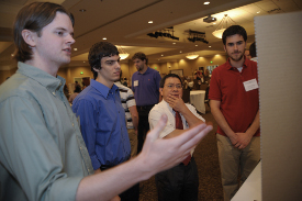 Union engineering professor Don Van discusses a research project with Bradley Kiddie, Aaron Porterfield and Eric Olson during the 2010 Scholarship Symposium. (Photo by Morris Abernathy)