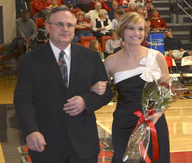 Andi Schreiber (right), the 2011 Homecoming queen, is escorted by her father, Mike Schreiber. (Photo by Morris Abernathy)