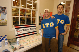 Alpha Tau Omega members Scott Talley (left) and Derek Jones work a table collecting money for Campus Crusade for Christ's Military Ministries. (Photo by Morris Abernathy)