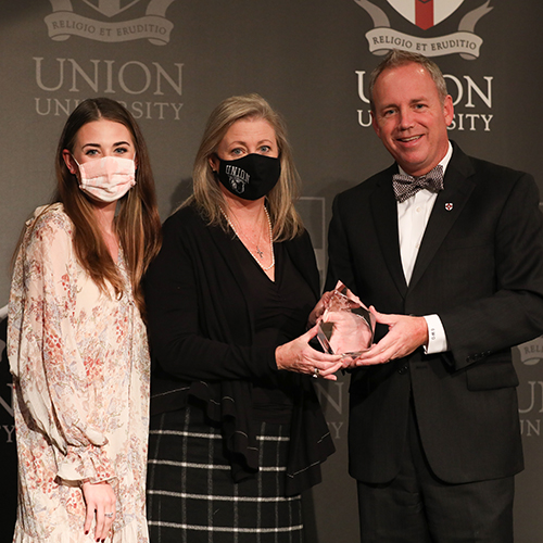 Brooke Emery, assistant professor of marketing, and her daughter, Sarah, accepted the Union Family Legacy Award on behalf of the Polk Glover Family during the Meritorious Service Awards Banquet Nov. 6. (Photo by Sarah Goff)