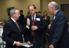 David Dockery, president of Union University, visits with Mike Weeks, Union's chairman of trustees and Rev. Skip Parvin, pastor of the First Baptist Church, Milan during the 2003 Red Carpet Banquet.