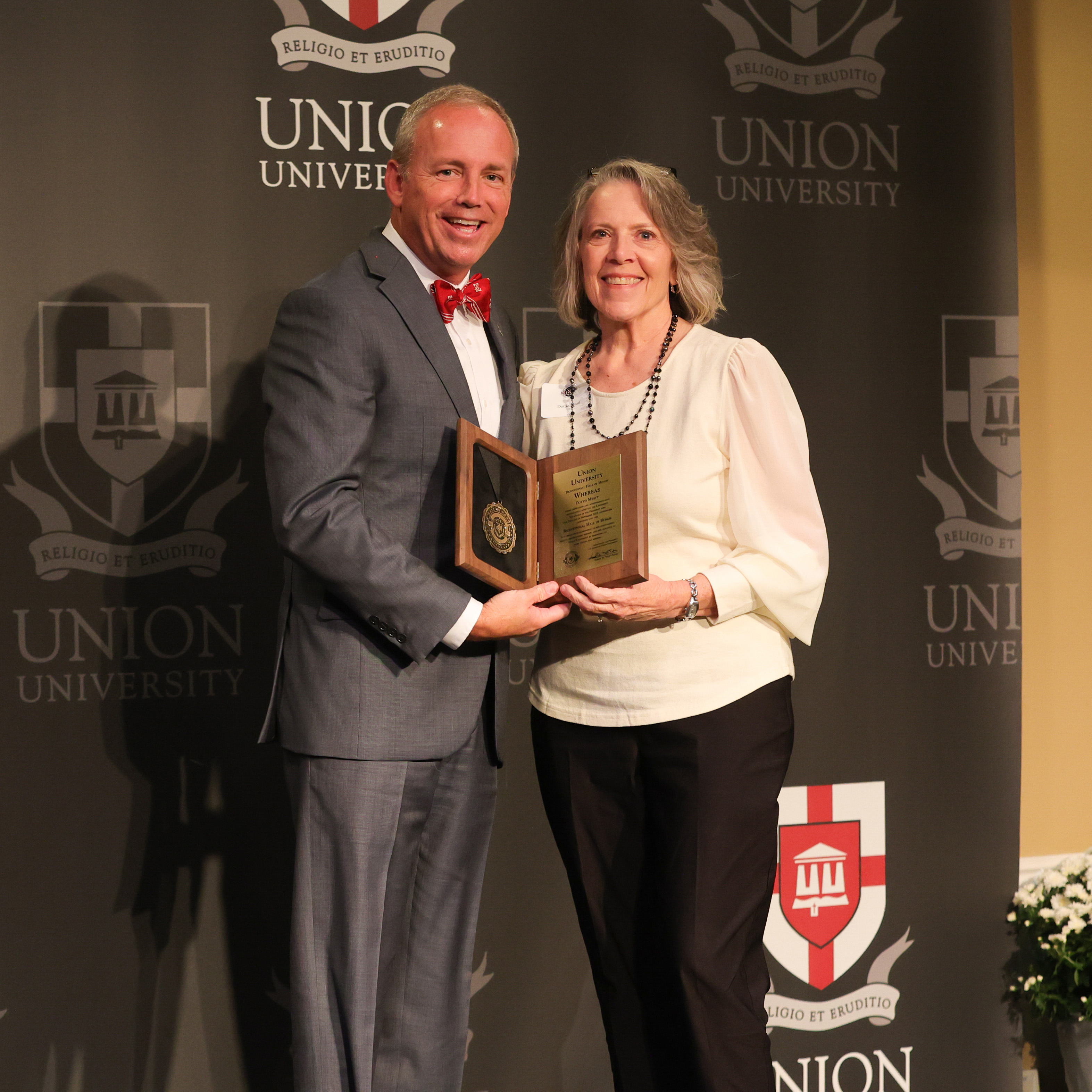 Union president Samuel W. "Dub" Oliver presents Hall of Honor award to Dottie Myatt at Legacy Luncheon on Sept. 23. (Photo by Suzanne Rhodes) 