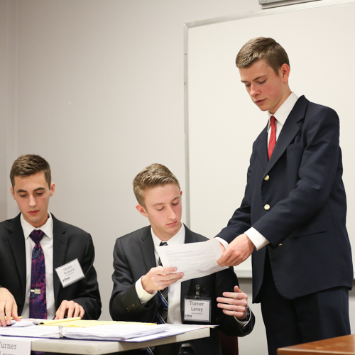Quinn Roberts, Turner Levey and Michael Gilbreath compete in a team policy debate during the National Invitational Tournament of Champions. (Photo by Kristi Woody)