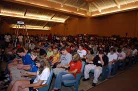 New students are circled by their parents and Union faculty, staff and upperclassmen who grasp hands in prayer for dedication and commitment to God as the students prepare to enter college.