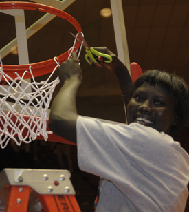 Zeinab Chan cuts the net following the Lady Bulldogs' national championship victory. (Photo by Morris Abernathy)