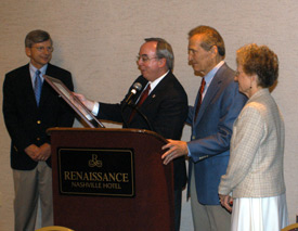 Union University President David S. Dockery (center) presents Adrian Rogers, pastor emeritus of Bellevue Baptist Church in Memphis, Tenn., with the M.E. Dodd Denominational Service Award. Also pictured are Harry Smith, left, Union University trustee, and Joyce Rogers, right. (Photo by Morris Abernathy)
