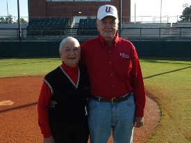 Benny Fesmire and his wife Norma pictured on the baseball field that bears their name. (Photo by Morris Abernathy)