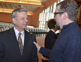 Taylor Worley (right) congratulates Walton Padelford on his appointment as the Porter Family Professor of Business and Economics. (Photo by Morris Abernathy)