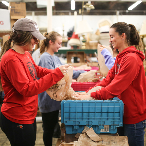 The Union women's soccer team serves at RIFA during the 15th annual day of remembrance. (Photo by Kristi Woody)