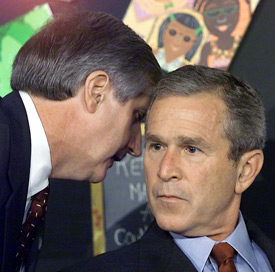 Andrew Card informs President Bush about the Sept. 11 terrorist attacks on the World Trade Center. Card, President Bush's former chief of staff, and Leon Panetta, chief of staff for President Clinton, will be the speakers at this year's Scholarship Banquet Oct. 23. (Photo by Paul J. Richards/Getty Images)