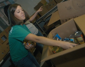Union senior Kellie Sneddon helps sort food at the Regional Inter-Faith Association as part of last year's Campus and Community day. (Photo by Angela Abbamonte)