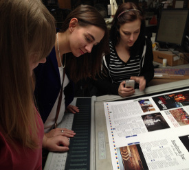 Cardinal & Cream staff members (from left) Courtney Brown, Katherine Burgess and Rebecca Morris do a press check of the magazine in Nashville. The Cardinal & Cream was named the best college magazine by the Southeast Journalism Conference.