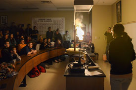 Chemistry students perform a demonstration in White Hall during the annual Fire and Light Demonstrations. (Photo by Zac Calvert)
