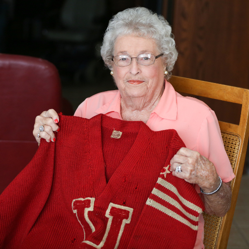 Carolyn Clements holds her father's Union University letterman sweater from 1929. (Photo by Kristi Woody)