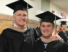 John Crockarell Jr. (left) and his son Chip Crockarell each graduated on May 16 with a Master of Business Administration degree. (Photo by MiKalla Cotton)