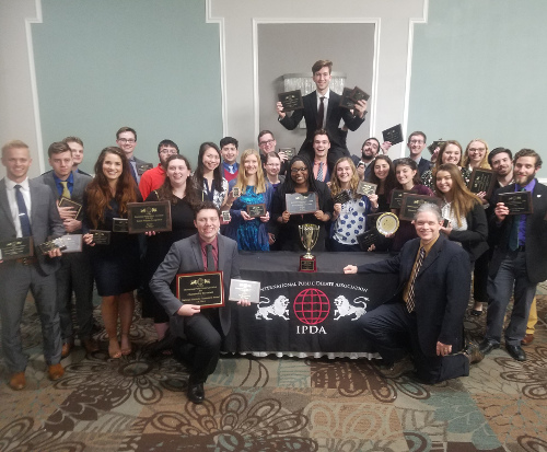 Union University debate team members display their awards at at the International Public Debate Association’s National Championships tournament in Reno, Nevada.