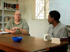 Brian Denker (left) teaches  at the Resurrection Library in Addis Ababa, Ethiopia. Also pictured is Denker's translator, Fikadu Assefa.