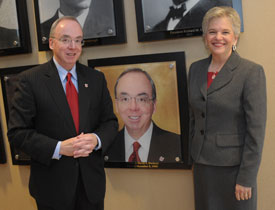 David and Lanese Dockery pose next to the portrait of Dr. Dockery added to wall of Union University presidents in the Carl Grant Events Center. (Photo by Morris Abernathy)