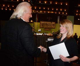Norwegian filmmaker Odd Hynnekleiv presents recent Union graduate Rachael Kapavik with an award for her film "Enough" during the 8th annual Student Film Festival. Tyler Litton co-wrote and co-directed the movie with Kapavik. (Photo by Victoria Stargel)