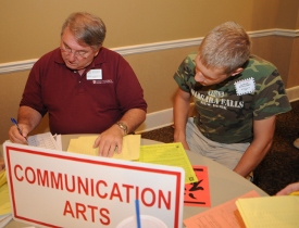 Incoming freshman Aaron Rowland of Bartlett, Tenn., gets assistance on his class schedule from Union journalism professor Michael Chute. (Photo by Morris Abernathy)
