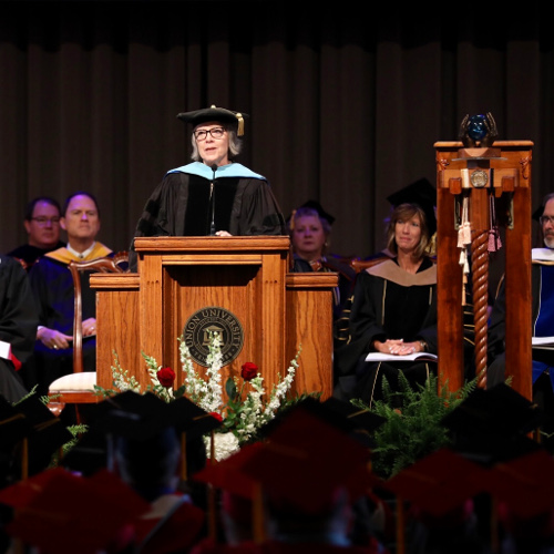 Dottie Myatt, retired assistant dean for teacher education and accreditation, speaks at summer commencement July 28. (Photo by Kristi Woody)